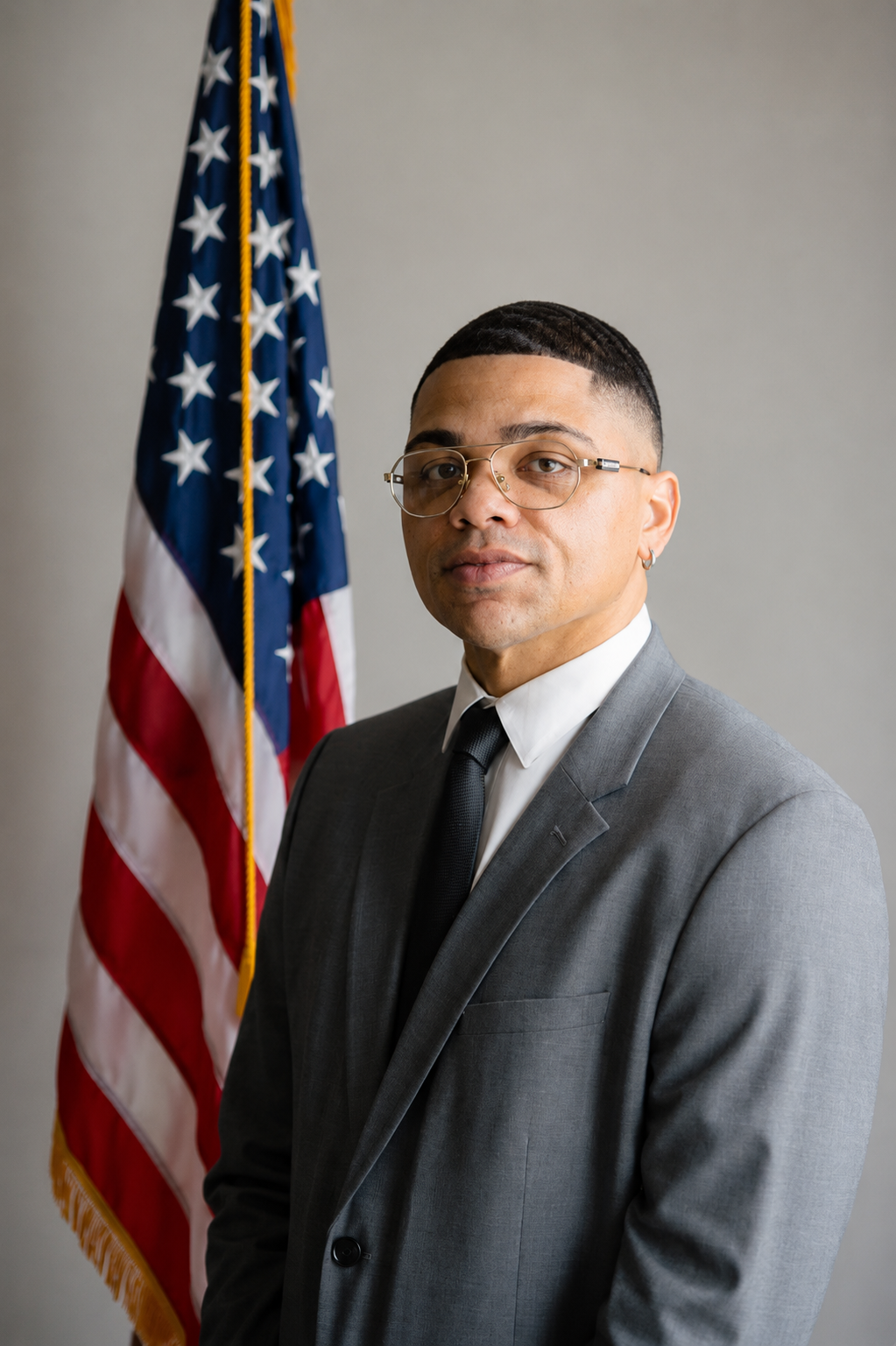 Portrait of attorney Matt Lawson in front of an American flag